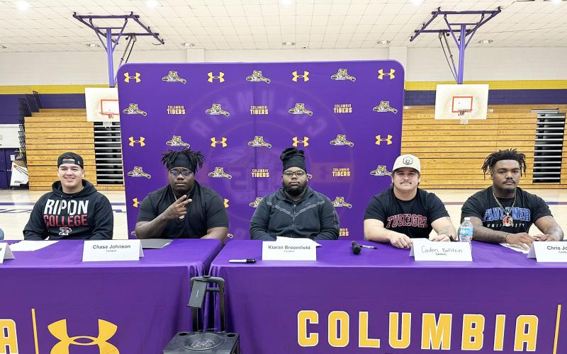 Columbia kicker Rolando Dominguez Jayo (from left), offensive lineman Chase Johnson, offensive lineman Kiaran Broomfield, defensive lineman Caden Bolstein and linebacker Chris Jordan signed letters of intent to play collegiately on Wednesday. Dominguez Jayo and Broomfield are headed to Ripon College, while Johnson and Bolstein will play at Tuskegee and Jordan will suit up for Faulkner. (JORDAN KROEGER/Lake City Reporter)
