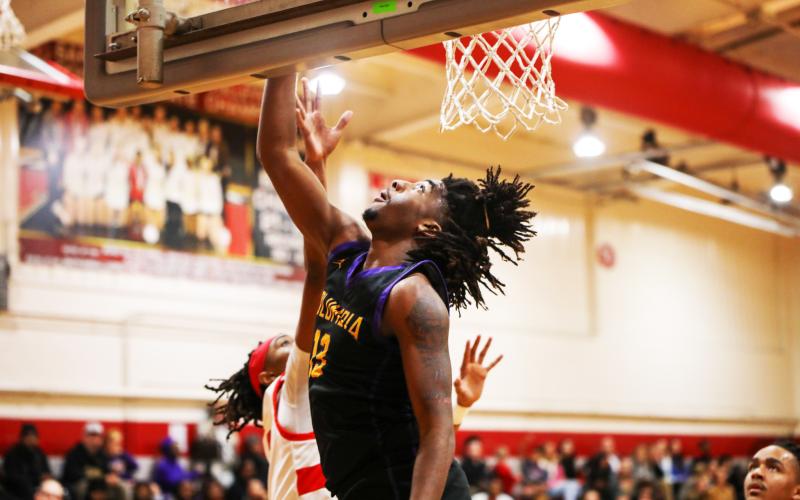 Columbia forward Zavian Douglas makes a layup against Santa Fe on Jan. 24. (BRENT KUYKENDALL/Lake City Reporter)