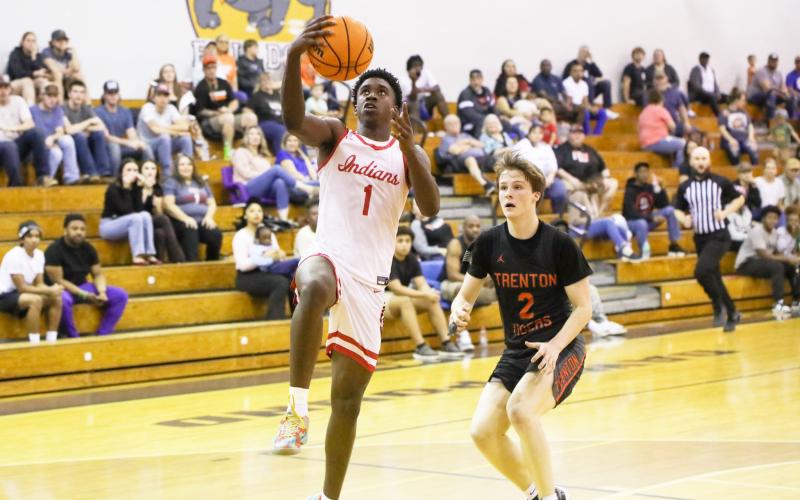 Fort White guard Jayden Jackson rises for a layup against Trenton in the District 6-R championship on Feb. 7. (BRENT KUYKENDALL/Lake City Reporter)