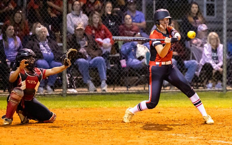 Fort White's Sydnee Mills swings at a pitch against Hamilton County on Tuesday night. (JACK HOWDESHELL/Lake City Reporter)
