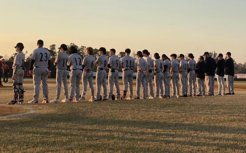 Fort White’s baseball team stands along the first-base line prior to Wednesday’s game against Hamilton County. (COURTESY)