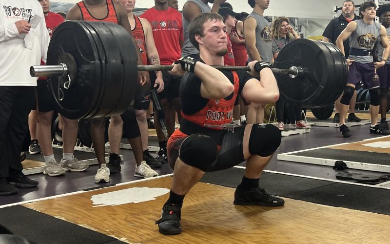Fort White’s Hayden McCrory performs the clean and jerk during Wednesday’s tri-meet against Columbia and Baker County. (COURTESY)