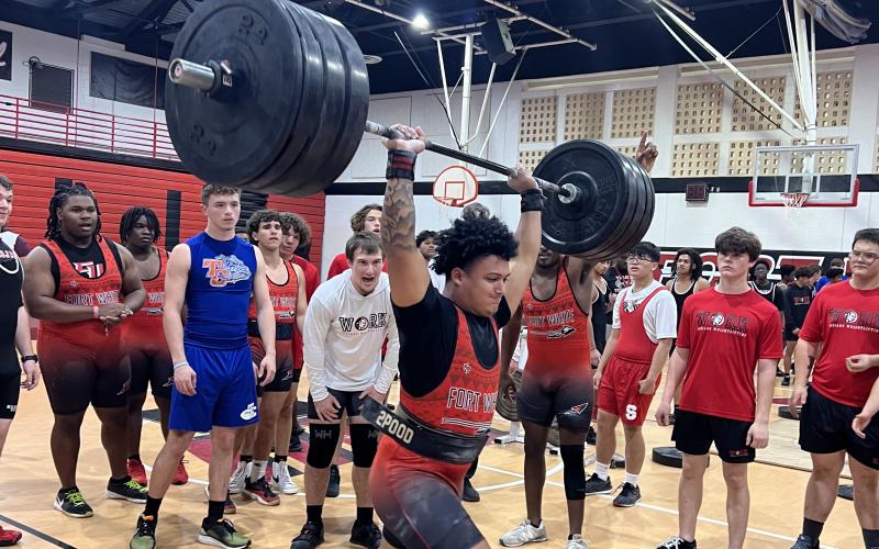 Fort White lifter Lecosta Byrd completes his clean and jerk during Monday’s meet. (COURTESY)