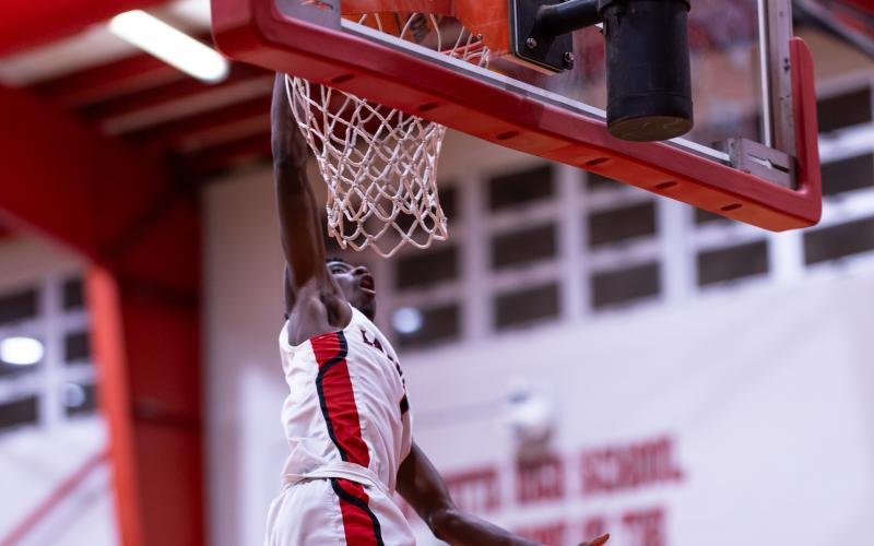 Lafayette guard Jordan Murphy dunks against Fort White on Dec. 5, 2024. (JACK HOWDESHELL/Lake City Reporter)