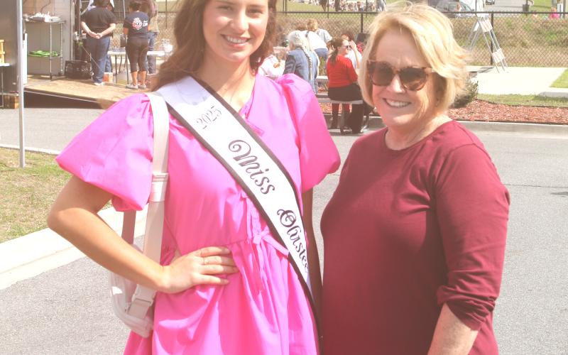 Miss Olustee Layla Merola, a Suwannee High senior, smiles with Patti Aldous of the Miss Olustee pageant during Friday’s opening of the Olustee Festival. (TONY BRITT/Lake City Reporter)