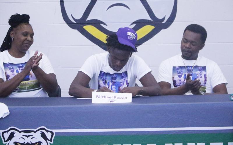 Suwannee receiver MJ Rossin signs his letter of intent to play collegiately at Western Carolina on Wednesday. (JAMIE WACHTER/Lake City Reporter)