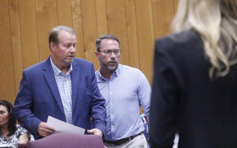 Hamilton County Clerk of Court Greg Godwin, talking with Rep. Jason Shoaf ahead of Monday’s delegation hearing, told the legislators that the courtroom would look different before they return thanks to state funding for renovations. (JAMIE WACHTER/Lake City Reporter)