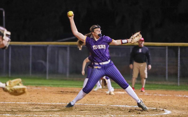 Columbia pitcher Harleigh Price winds up to pitch against Baldwin on Feb. 25. (BRENT KUYKENDALLL/Lake City Reporter)