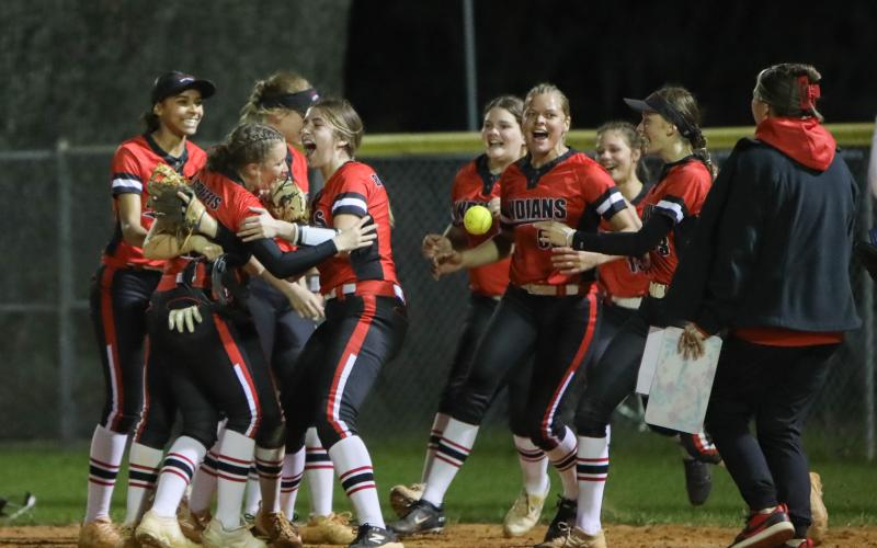 Fort White's softball team celebrates after defeating Columbia 4-3 on Wednesday night. (BRENT KUYKENDALL/Lake City Reporter)