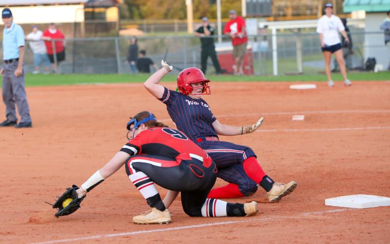 A throw to Fort White third baseman Hannah LeBleu isn't in time during Thursday's game against Wakulla. (BRENT KUYKENDALL/Lake City Reporter)
