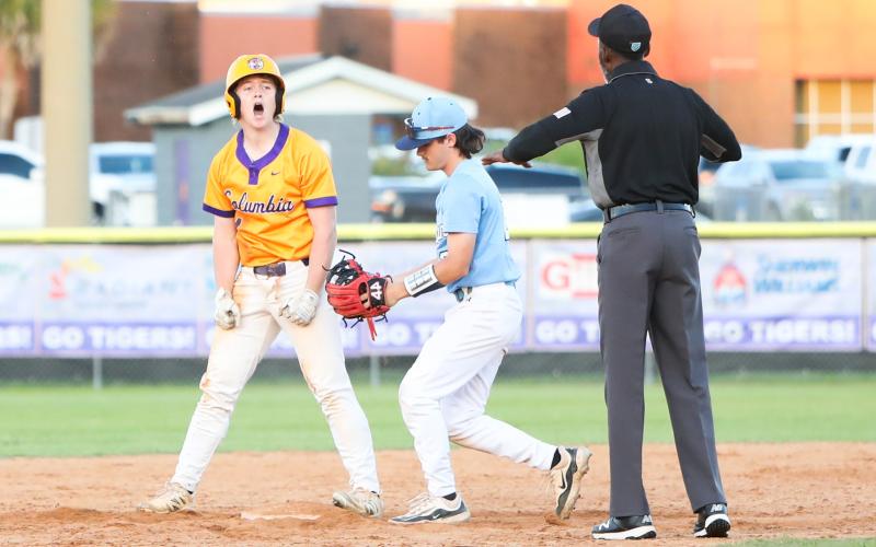 Columbia right fielder Trayce McKenzie celebrates at second base after hitting an RBI double against St. Johns Country Day on Tuesday. (BRENT KUYKENDALL/Lake City Reporter)