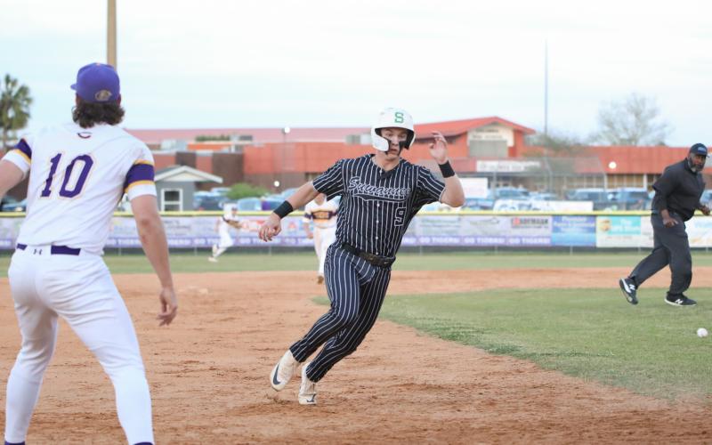 Suwannee third baseman Jace Moran rounds third base to head home for a run against Columbia on Thursday. (BRENT KUYKENDALL/Lake City Reporter)