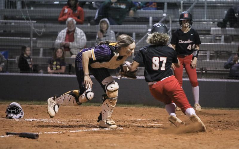 Columbia catcher Emily Delgado tags out Dunnellon center fielder Olivia Joiner to end the game Tuesday night. (BRENT KUYLENDALL/Lake City Reporter)