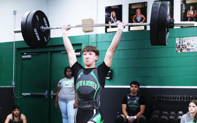 Suwannee’s Kamden Lang completes his clean and jerk rep during the Bulldogs’ meet against Madison County on Monday. (PAUL BUCHANAN/Lake City Reporter)