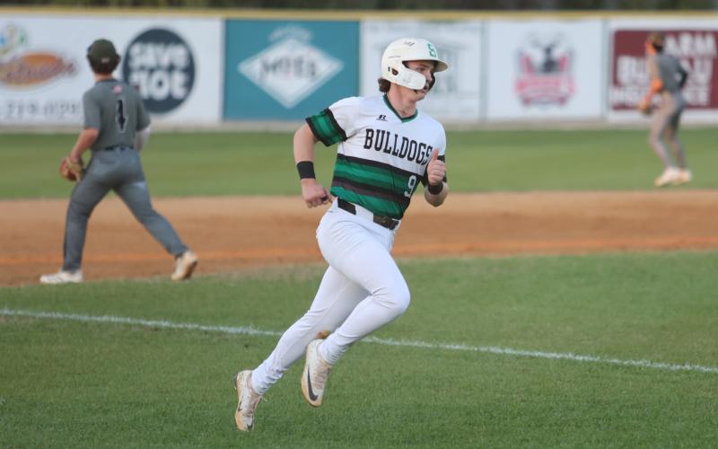 Suwannee's Jace Moran scores a run against Chiles on Tuesday night. (PAUL BUCHANAN/Lake City Reporter)