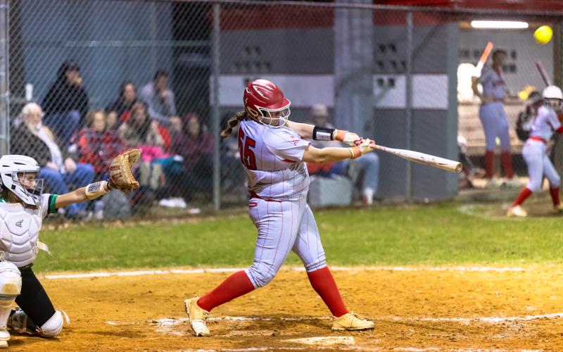 Lafayette pitcher Khloe Crotts hits a three-run homer in the bottom of the sixth inning against Suwannee on Thursday. (JACK HOWDESHELL/Lake City Reporter)