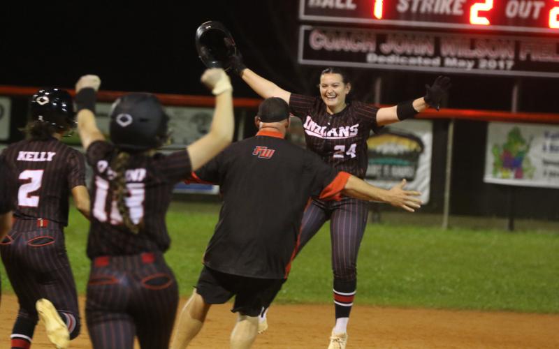 Fort White pitcher Kadence Compton (24) celebrates after her walk-off two-RBI double Tuesday against Santa Fe. (MORGAN MCMULLEN/Lake City Reporter)