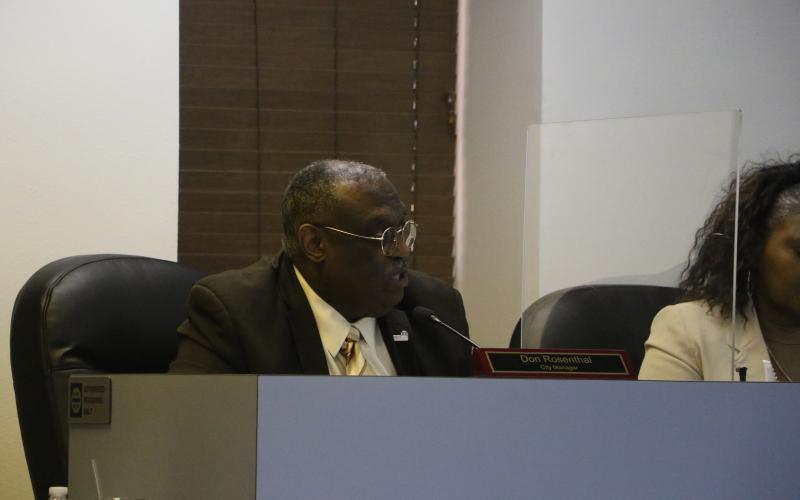 Lake City Manager Don Rosenthal speaks during Monday’s meeting after earlier having to be restrained from confronting Sylvester Warren. (MORGAN MCMULLEN/Lake City Reporter)