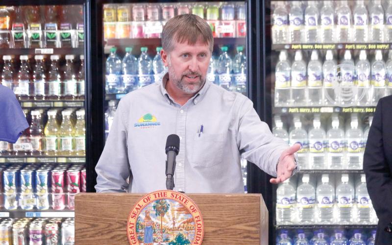 Suwannee County Commissioner Travis Land, pictured speaking at a press conference, said Matco Industries has shown no ambition to build its own rail spur at the county’s Catalyst Site the past 10 years. (FILE)