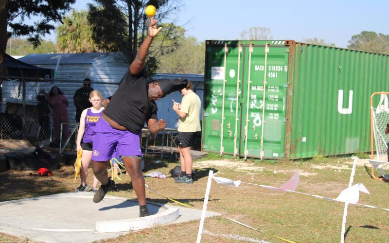 Columbia's De'Manuel Jones tosses during the shot put at the Santa Fe Freshman/Sophomore Invite on Wednesday. (COURTESY)