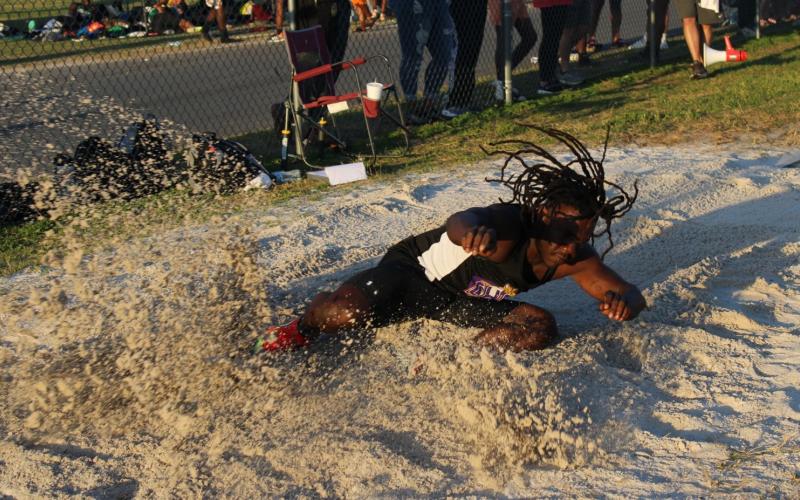 Columbia's Jeffrey Deal lands in the pit in the long jump at the Suwannee Mini Meet on Tuesday. (COURTESY)
