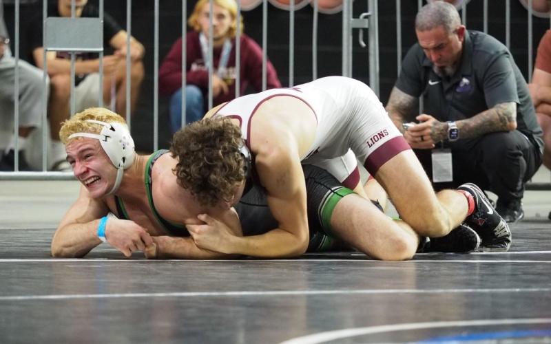 Suwannee wrestler Marshall White battles with First Baptist’s Andres DiGrigoli during the Class 1A IBT finals on Saturday. (DEE DEE JOLICOEUR/Special to the Reporter)