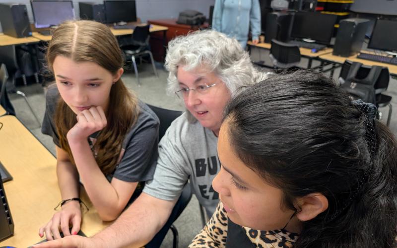 Suwannee Middle School teacher Tammy Neil (middle) gives directions to Lucy Kate Roberts (left) and Adelmary Jeronimo during broadcasting class Wednesday. Neil was honored as a top 30 influencer to watch by EdTech: Focus on K-12. (COURTESY)