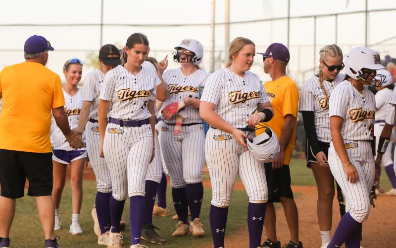 Columbia's Josie Raulerson celebrates with teammates after hitting a two-run home run against Riverside in the District 3-4A semifinals on Tuesday. (BRENT KUYKENDALL/Lake City Reporter)