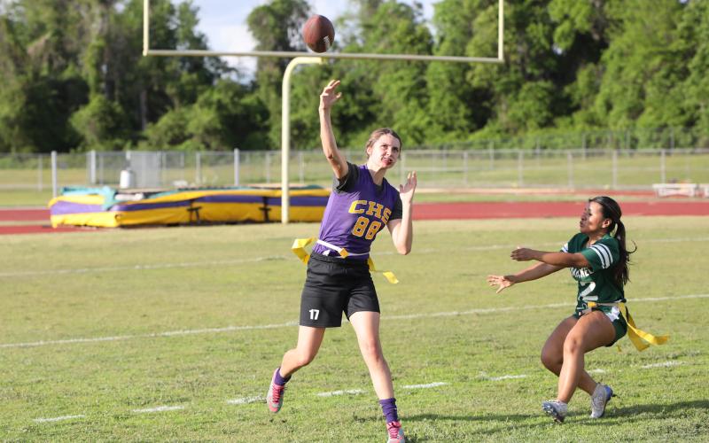 Columbia quarterback Mia Brasel rolls out to pass against Suwannee on Tuesday night. (BRENT KUYKENDALL/Lake City Reporter)