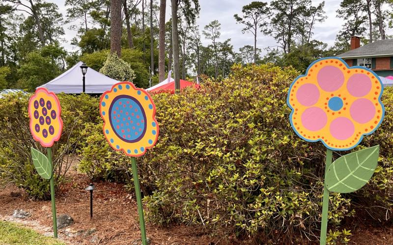 Wildflower displays welcome visitors to the Wildflower Festival at Heritage Park and Gardens last year. The festival returns May 10. A Chalk Art on the Trail will also be held this year on May 9. (COURTESY)