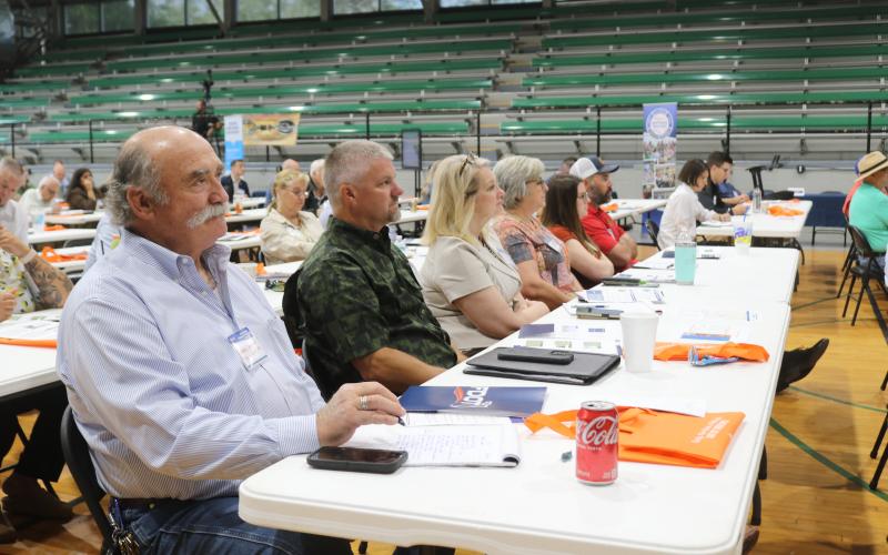 Live Oak City Manager Larry Sessions (left) listens during one of the presentations from state agencies about grant opportunities during the North Florida Transportation Planning Summit on Tuesday. Sessions was joined by Jerald Lee (second from left), the city’s public works director. (TONY BRITT/Lake City Reporter)