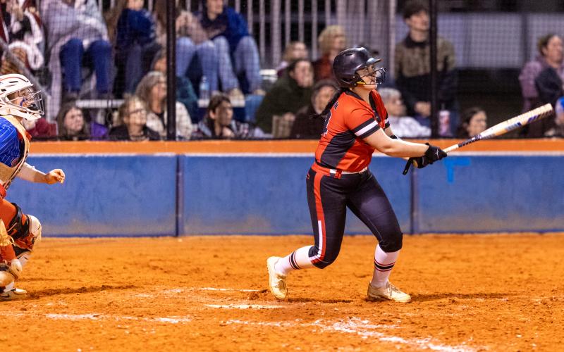 Fort White pitcher Kadence Compton watches her home run leave the park against Branford on March 10. (JACK HOWDESHELL/Lake City Reporter)