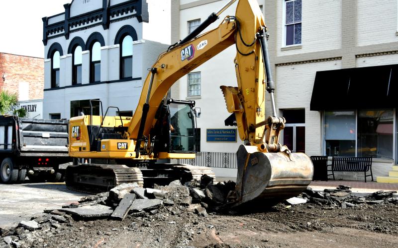 Crews with Live Oak Management Group tear up Howard Street (U.S. Highway 90) in downtown Live Oak on Monday to fix settling in the street that occurred following a water leak in December. (ROB WOLFE/Lake City Reporter)