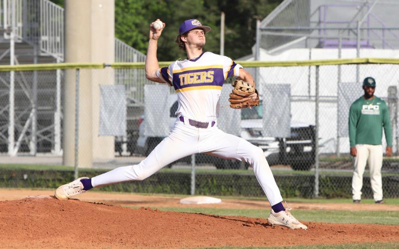Columbia pitcher Bynton Edge winds up to pitch against Flagler Palm Coast on April 4. (BRENT KUYKENDALL/Lake City Reporter)