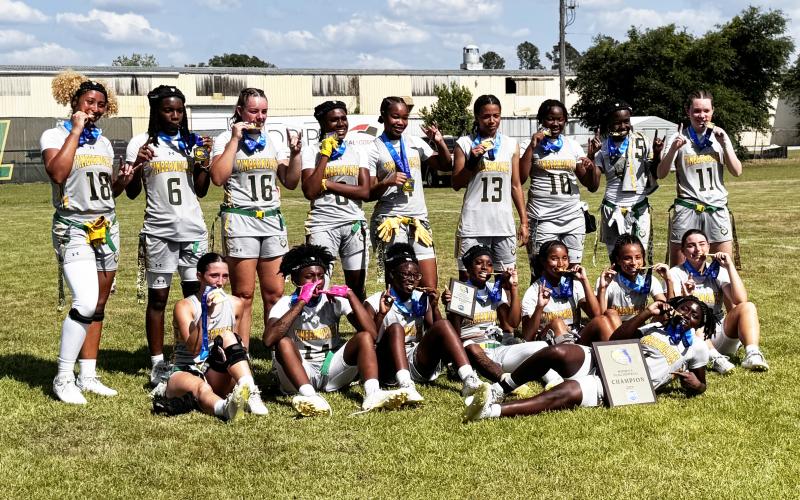 Florida Gateway College shows off its FCSAA championship medals after defeating Daytona State 37-0 on Saturday. (JAMIE WACHTER/Lake City Reporter)