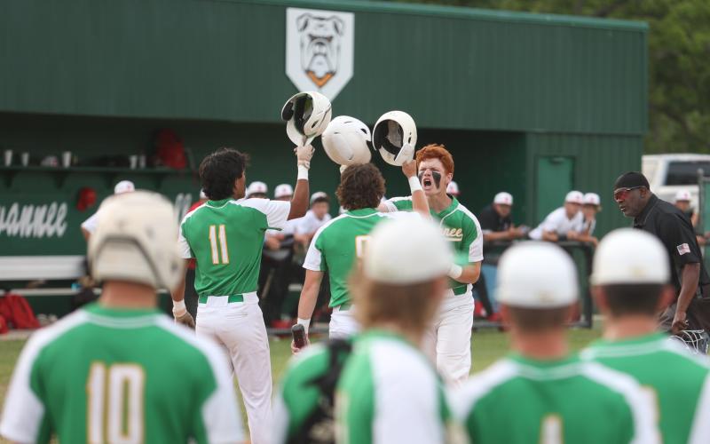 Suwannee right fielder Kyler Watson celebrates with teammates Gabe Garcia (11) and Jace Moran (9) after hitting a three-run home run against Baldwin in Game 1 of the Region 1-3A quarterfinals on Monday. (PAUL BUCHANAN/Lake City Reporter)