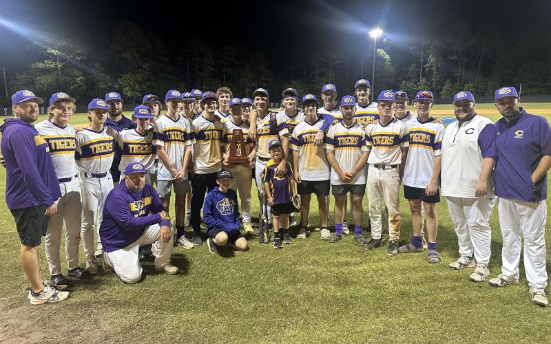Columbia’s baseball team poses with the District 3-5A trophy after defeating Ridgeview on Thursday. (JORDAN KROEGER/Lake City Reporter)