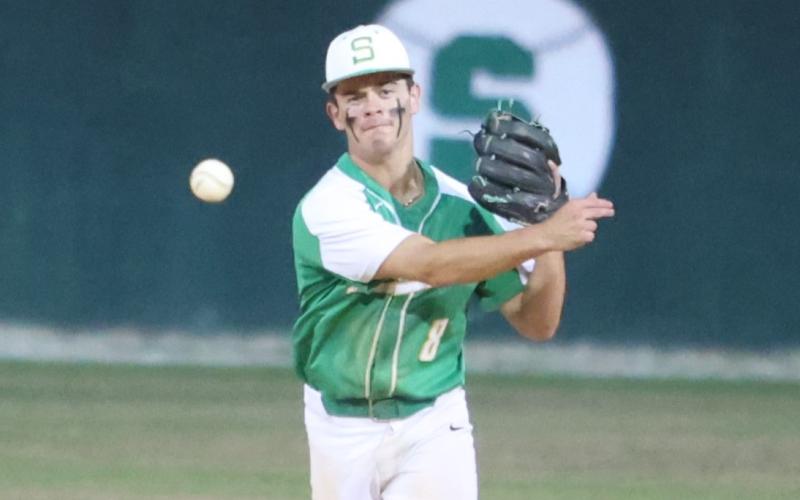 Suwannee second baseman Noah Lopez throws to first base for an out against Baldwin during Game 1 of the Region 1-3A quarterfinals on April 21. (PAUL BUCHANAN/Lake City Reporter)