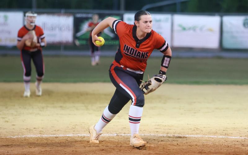 Fort White pitcher Kadence Compton winds up to pitch against Suwannee on April 4. (PAUL BUCHANAN/Lake City Reporter)