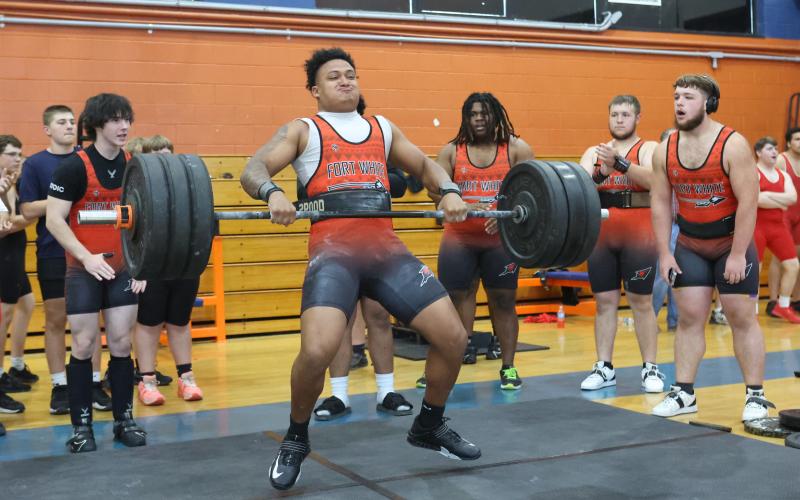 Fort White's Lecosta Byrd brings the bar up during the clean and jerk at the District 6-1A meet on March 28. (PAUL BUCHANAN/Lake City Reporter)