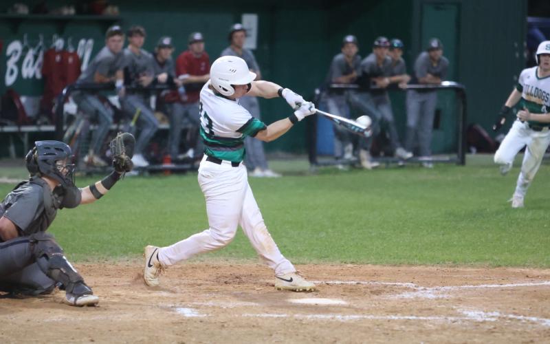 Suwannee catcher Grayson Bonds makes contact against Chiles on March 11. (PAUL BUCHANAN/Lake City Reporter)