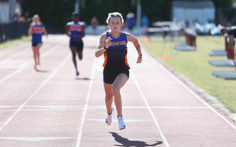 Branford runner Alex Whitfield races to the finish line to win the 100m title at the District 5-1A meet on Saturday. (PAUL BUCHANAN/Lake City Reporter)