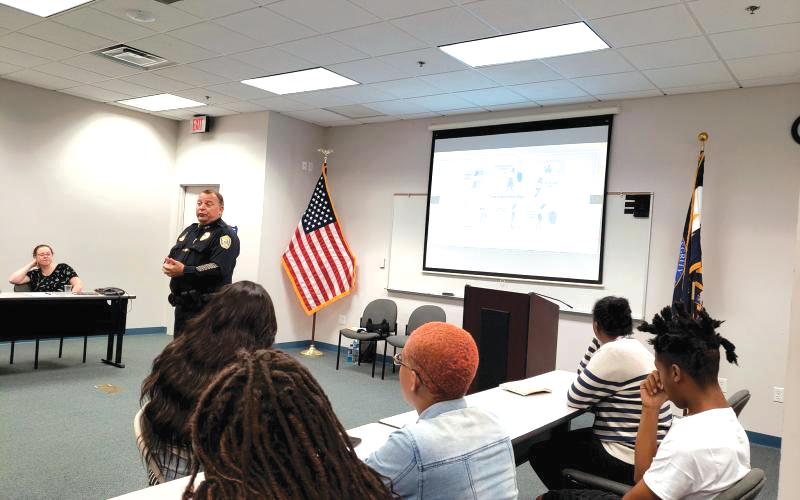 Lake City Police Chief Gerald Butler talks with teens about interviewing during the police department’s Sumer Youth Employment Program in 2019. (COURTESY)