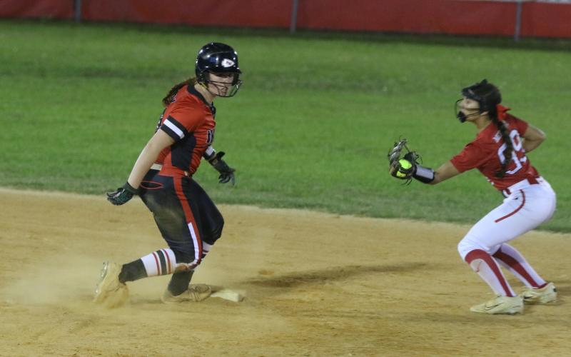 Fort White's Hannah LeBleu slides safely into second base in front of Williston's Grace McDaniel Tuesday night. LeBleu scored three batters later on Morgan Kelly's sac fly. (MORGAN MCMULLEN/Lake City Reporter)