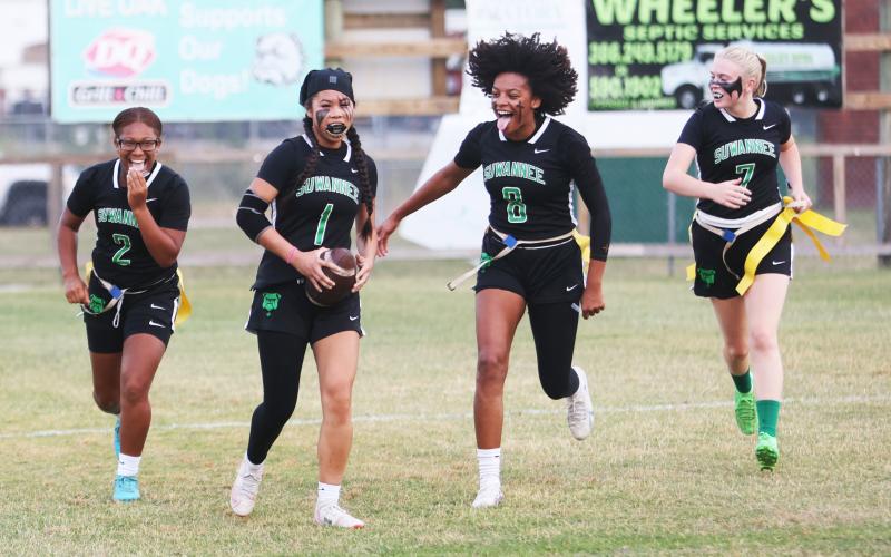 Suwannee defensive back Jessica Tran (1) celebrates with teammates Kayla Frederick-Woods (2), Alaira Handy (8) and Miranda Ramsey (7) after scoring on a pick-6 against Santa Fe during the Region 1-1A quarterfinals on Wednesday. (PAUL BUCHANAN/Lake City Reporter)