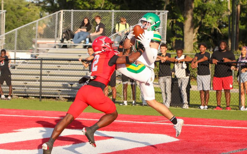 Suwannee receiver Koy Frier can't hold on to a catch that's wrestled away by Bradford defensive back Jordan Cason for an interception during the teams' spring game Thursday night. (BRENT KUYKENDALL/Lake City Reporter)
