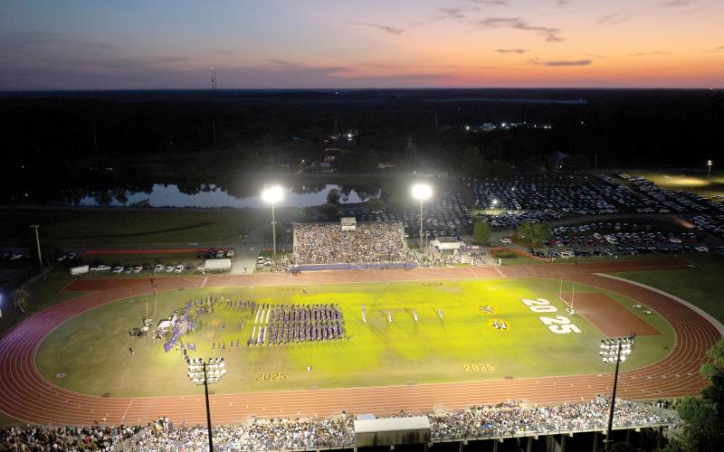 The sun sets Friday night over Tiger Stadium during Columbia High’s commencement ceremony for the Class of 2025. (RAY CARPENTER/Lake City Reporter)