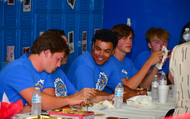 Members of The Ability Experience’s Gear Up Florida event enjoy dinner at The Arc North Florida last week. The group of 30 cyclists and six crew members stopped off in Live Oak on Florida on their biking event across the state. (ROB WOLFE/Lake City Reporter)