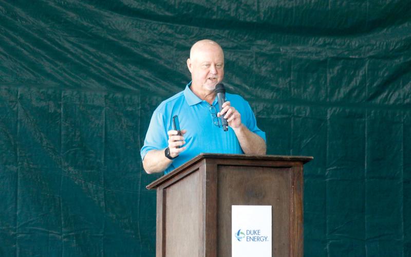 Duke Energy’s Jay Oliver holds up his cell phone as he talks Tuesday about how important batteries are to not just everyday life but also to the electric grid. (JAMIE WACHTER/Lake City Reporter)