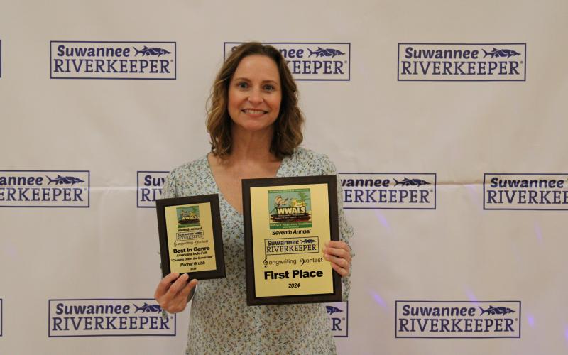 Lake City’s Rachel Grubb with her two prize plaques from last year’s WWALS River Revue. Grubb will headline this year’s event. (COURTESY KAREN CORBIN)